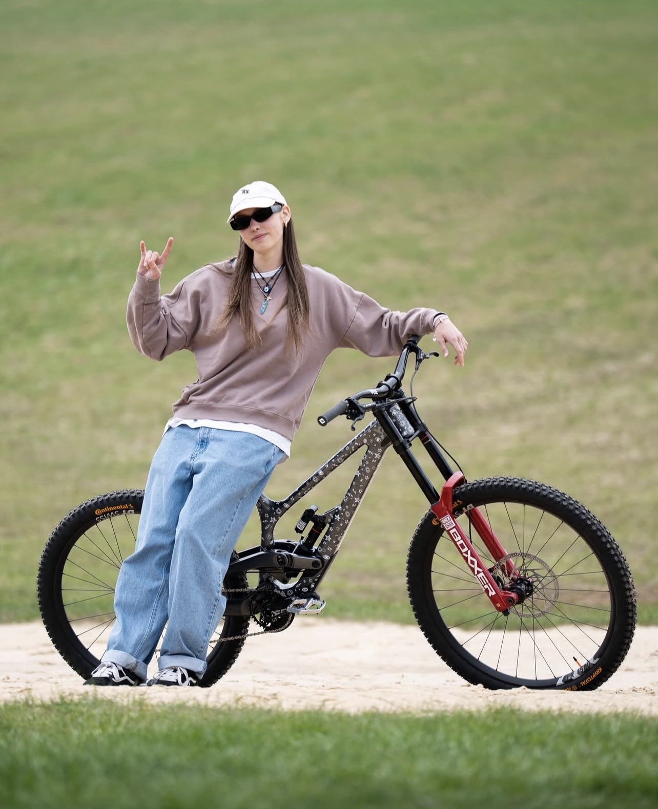Cyclist posing with a mountain bike