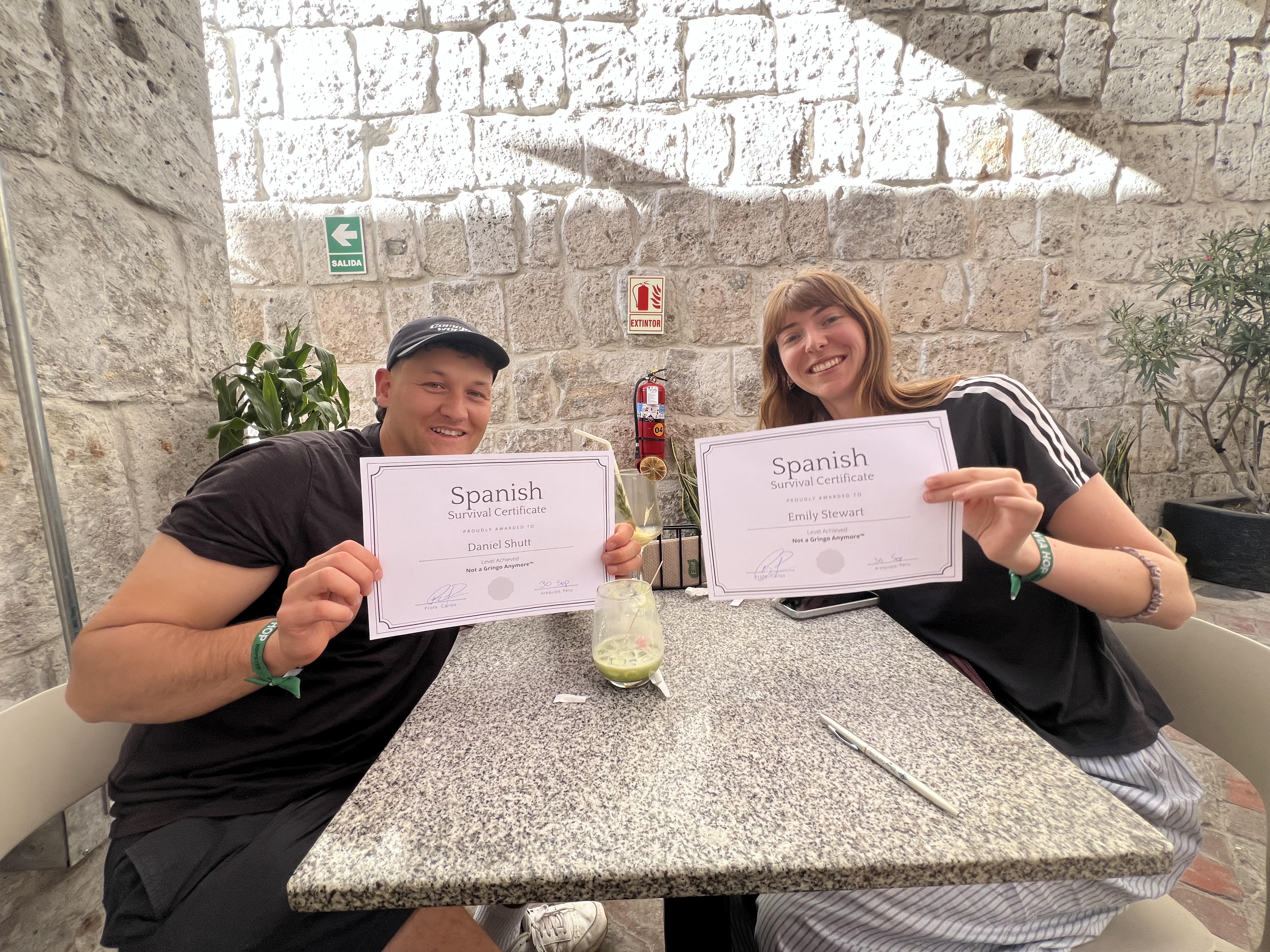 Participants holding their Spanish Survival Certificates